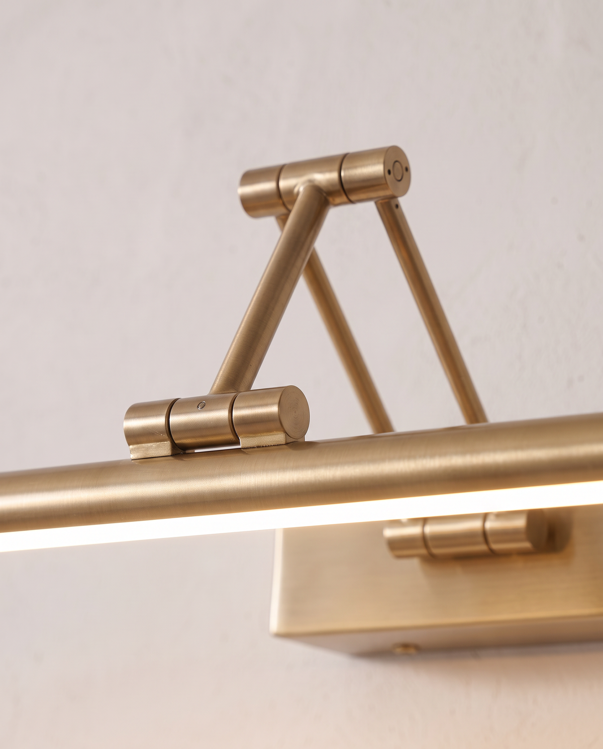 Close-up of the brass hinge and arm of The Gallery