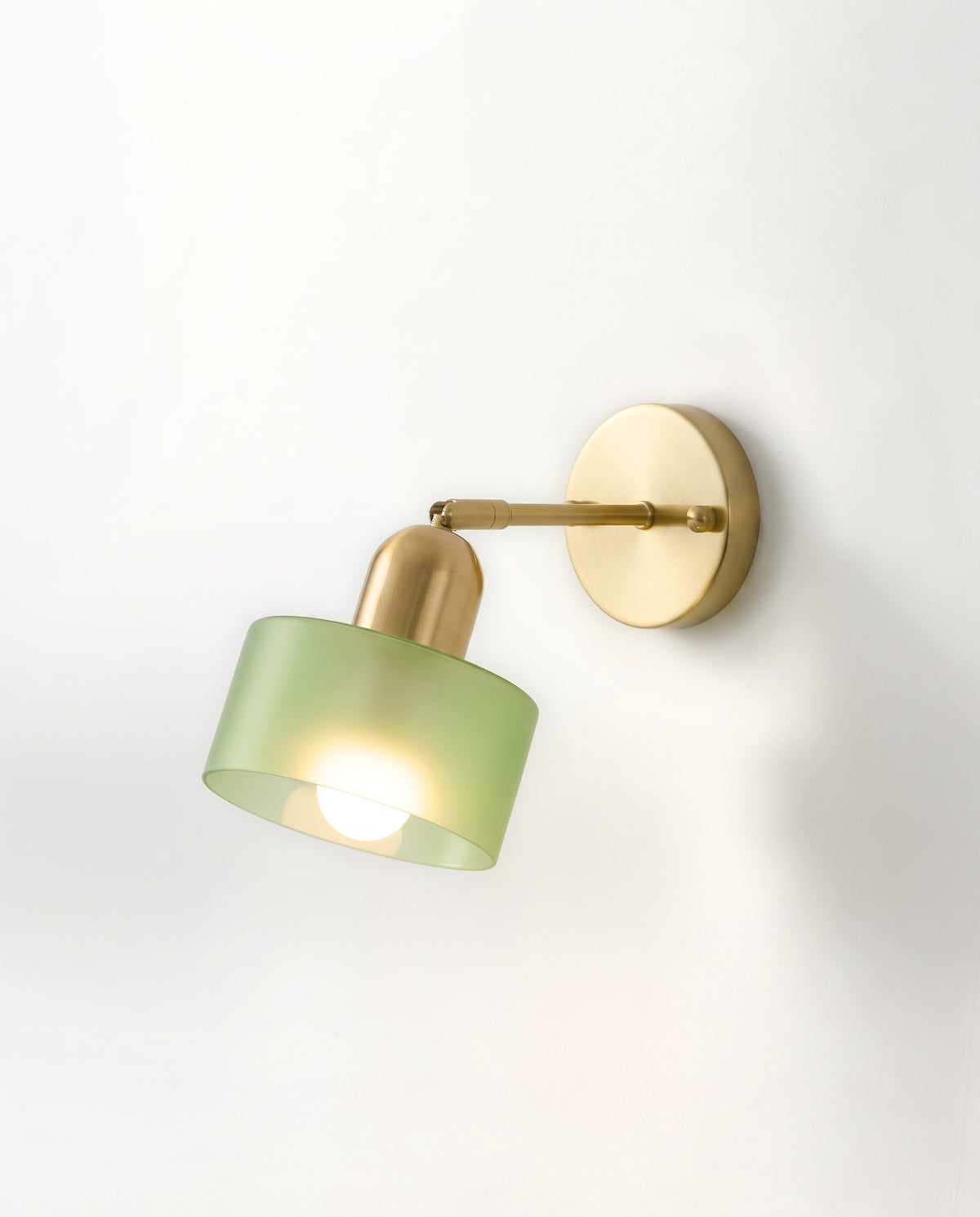 The Inkwell Wall Light with a frosted fern green glass shade