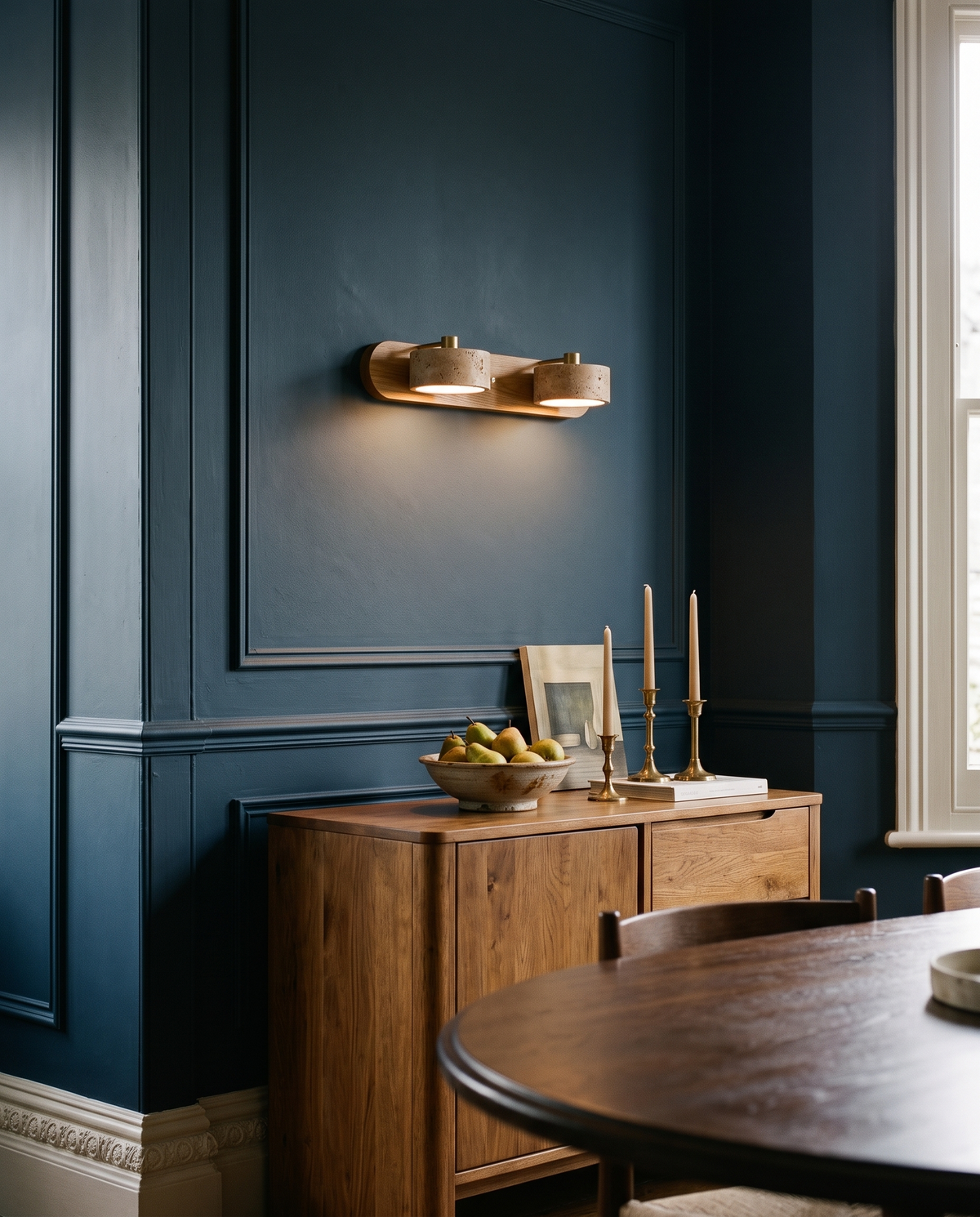 The Mantel above an oak sideboard in a navy dining room