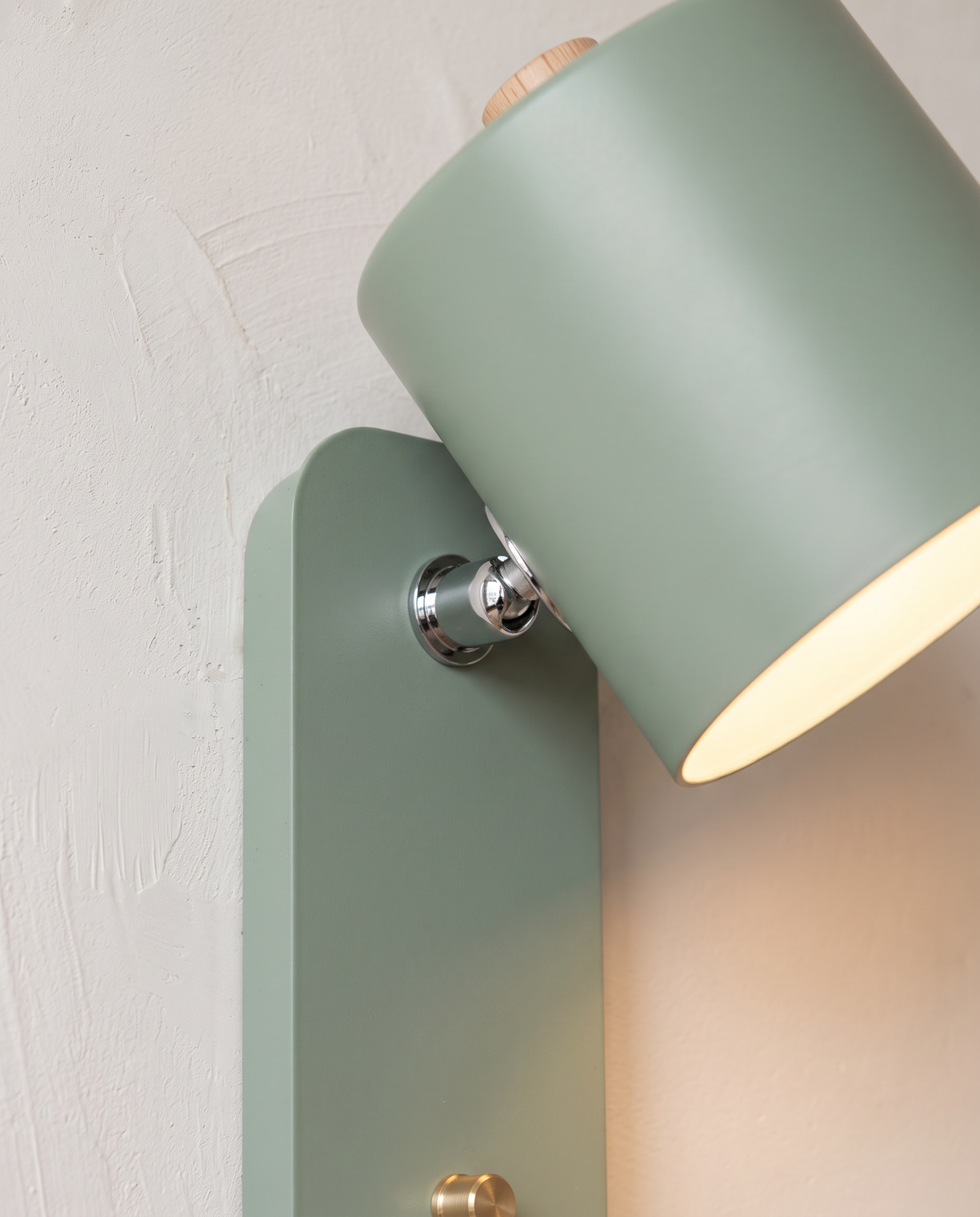 Close-up of the polished swivel joint and Sage shade of The Nightcap