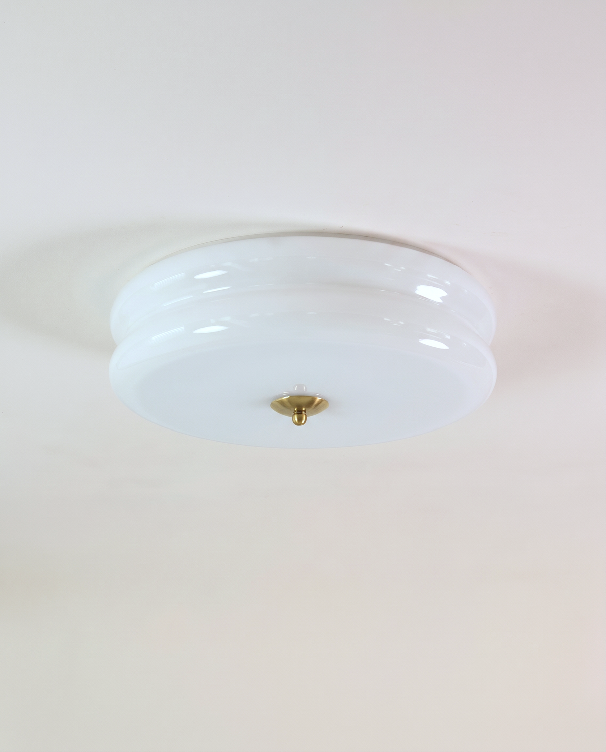 The Odeon Ceiling Light in Ivory glass with a gilt finial
