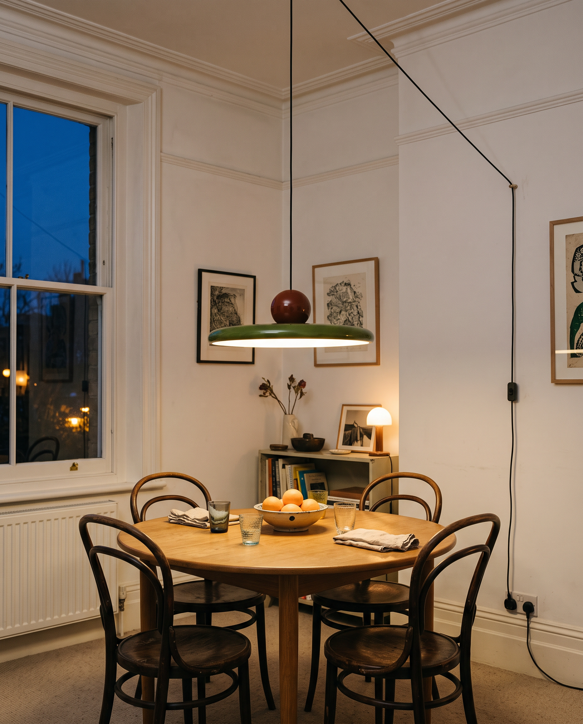 A Pulley in Oxblood & Olive over a round oak table in a rented London flat