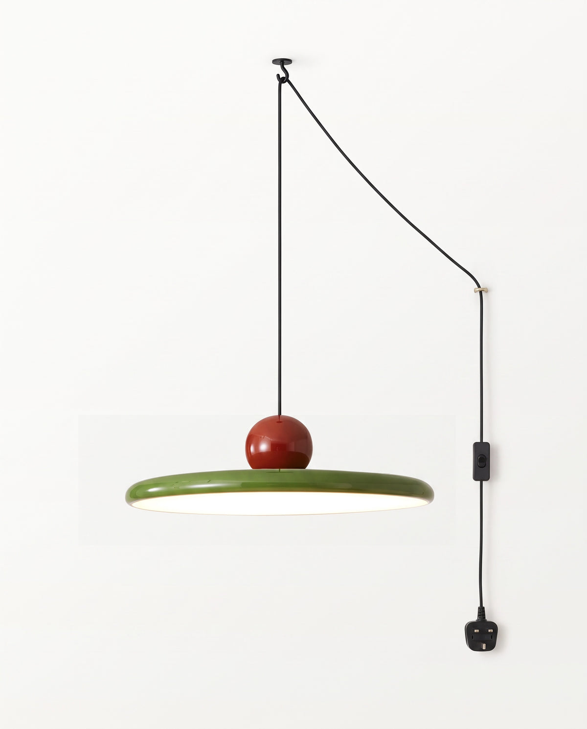 The Pulley Plug-in Pendant in Oxblood & Olive, its cord swagged over two ceiling hooks to a UK plug, lit