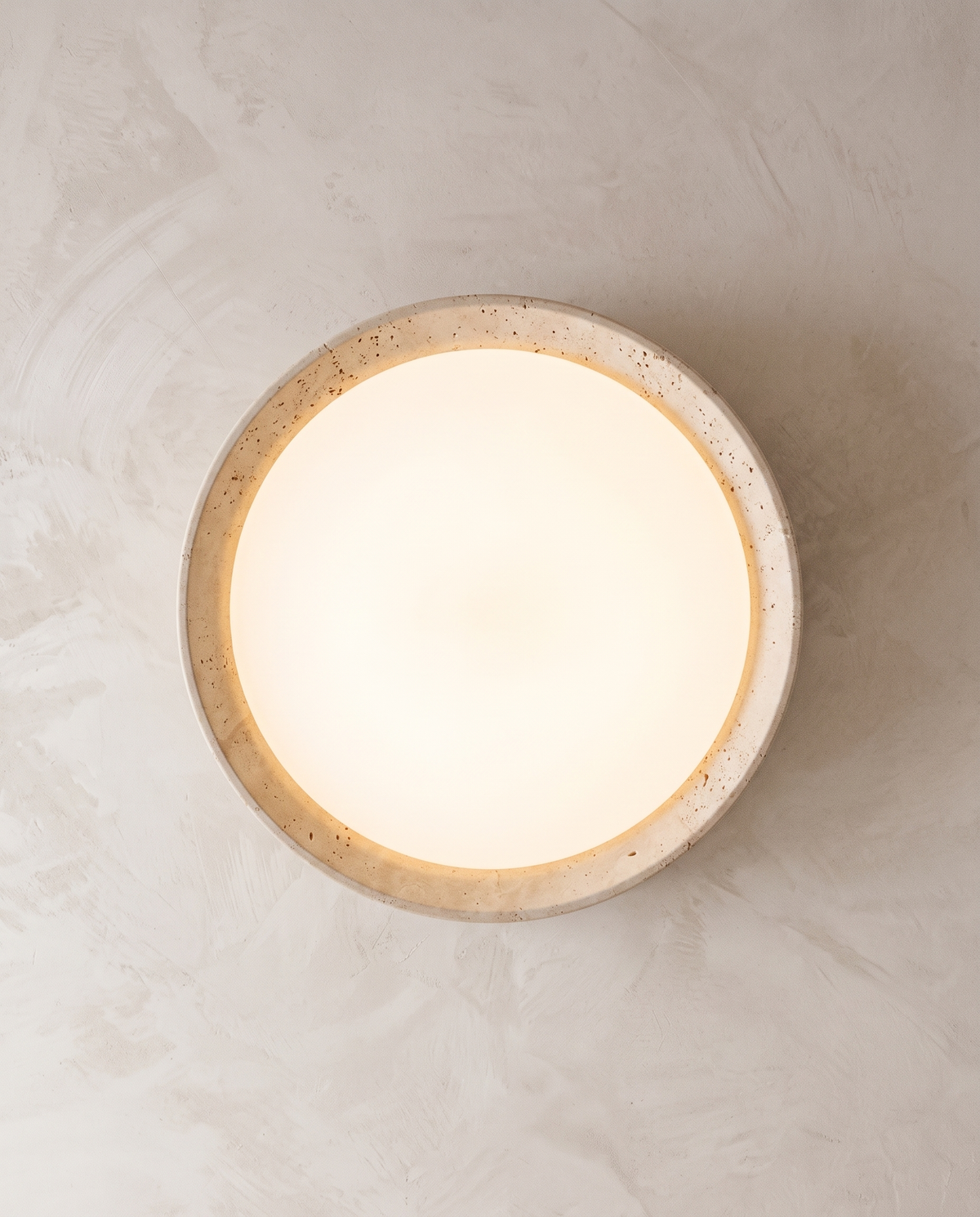 The Quarry seen from directly below, opal diffuser framed by travertine