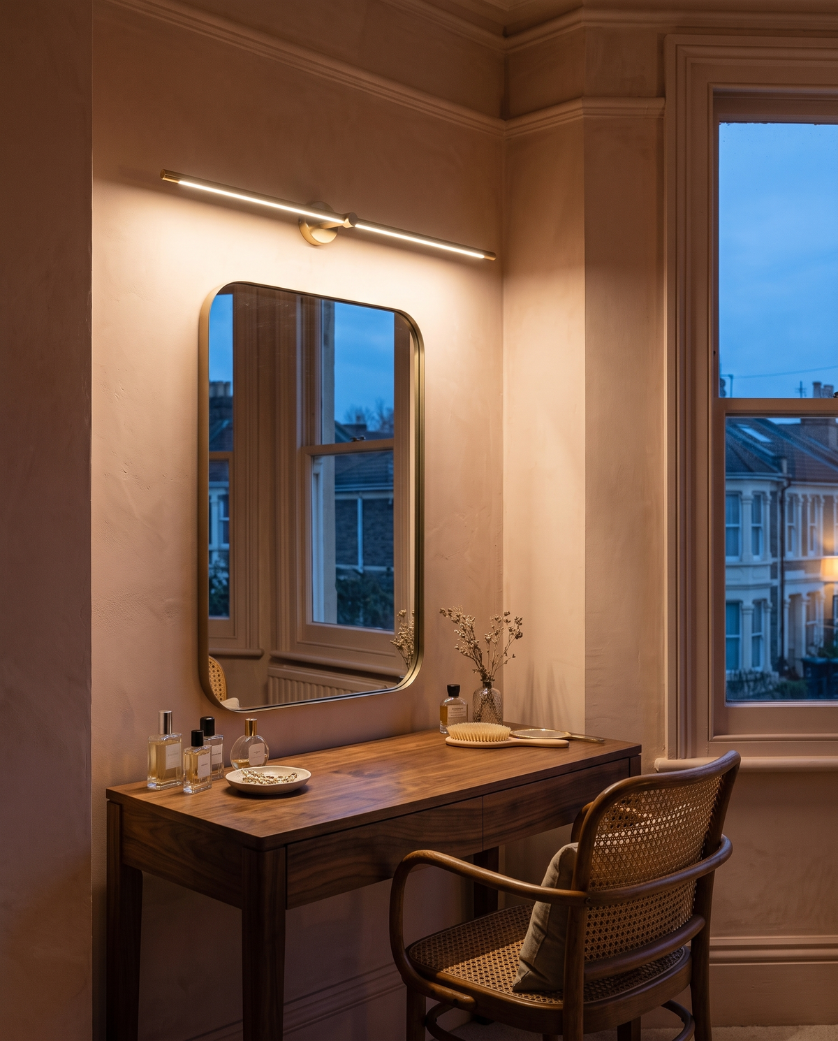 The Rail in Gold above a dressing-table mirror