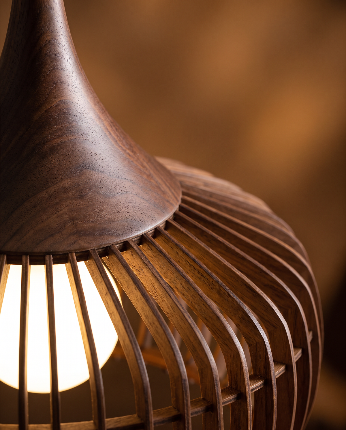 Close-up of the walnut ribs and top of The Ridge pendant
