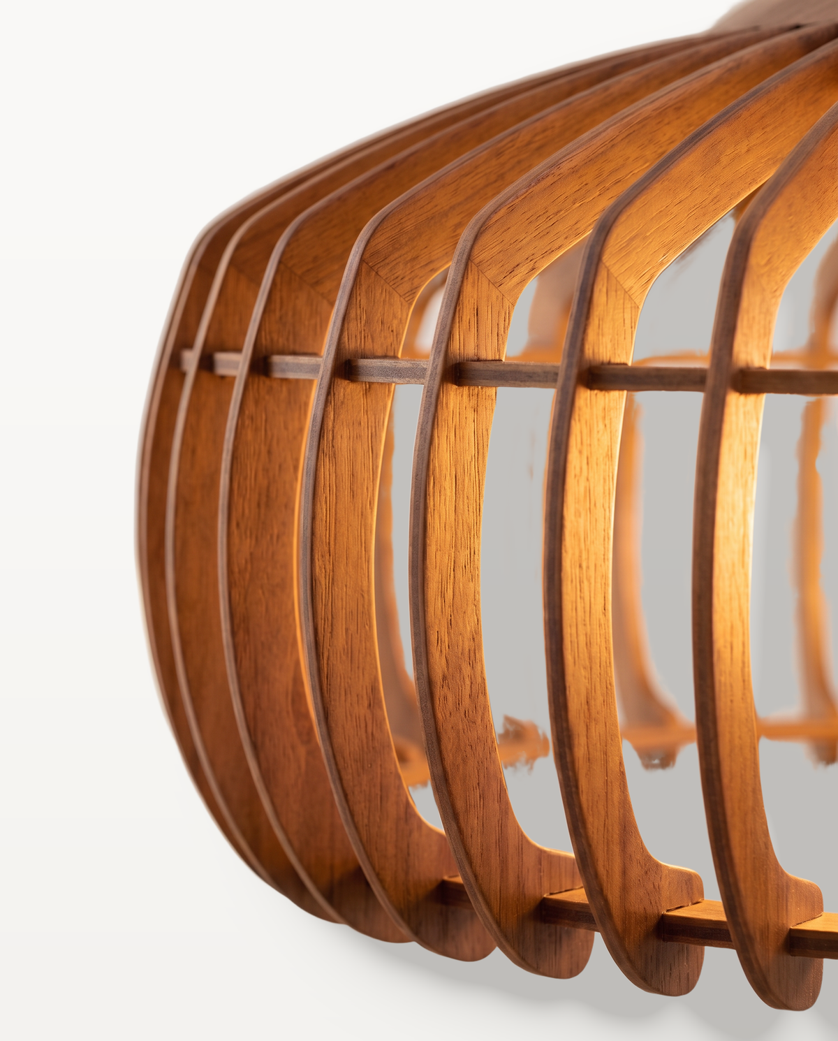 Close-up of The Ridge's curved walnut slats, lit from within