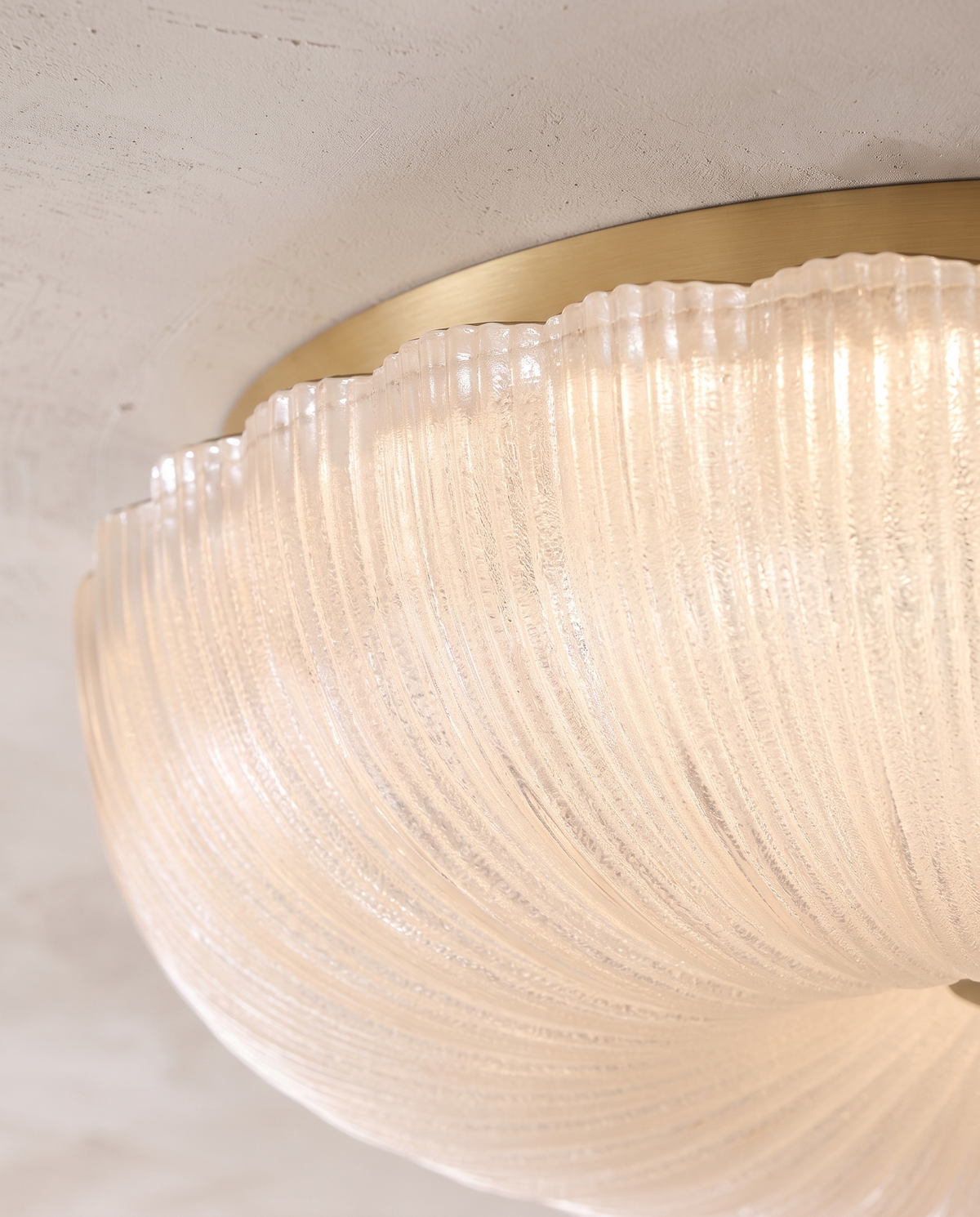 Close-up of the rippled glass and scalloped edge of The Ripple