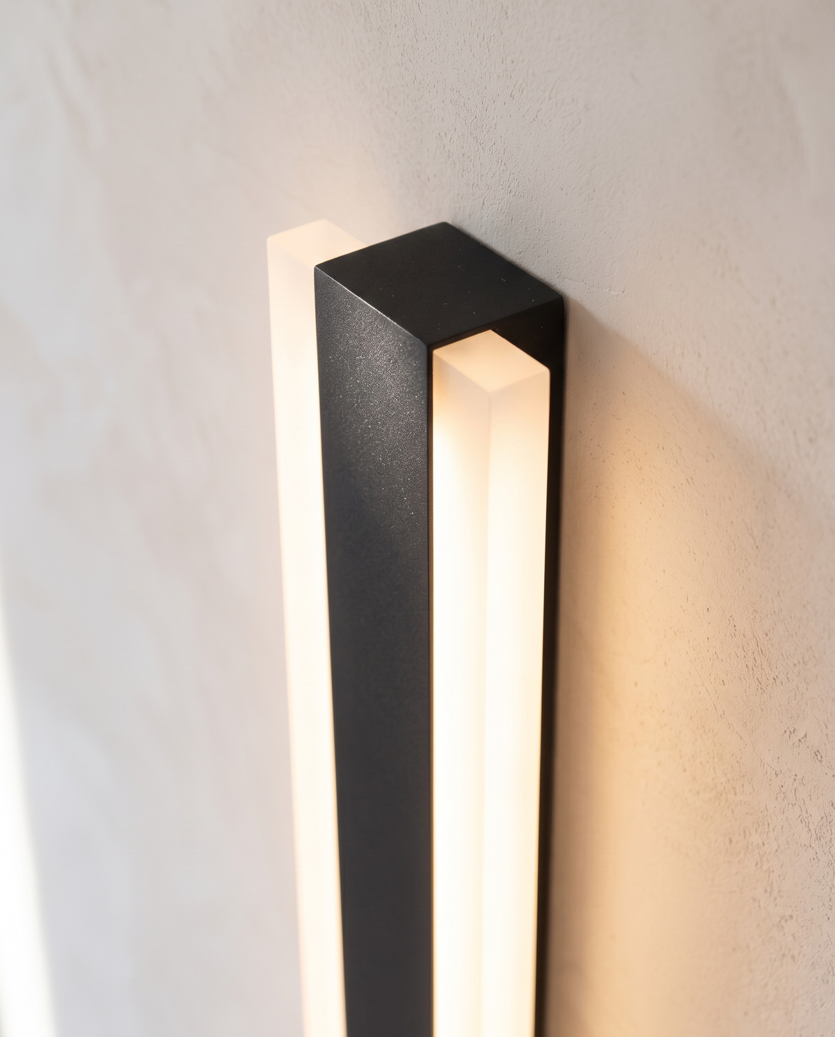 Detail of the Sentry's black aluminium face and opal side diffusers
