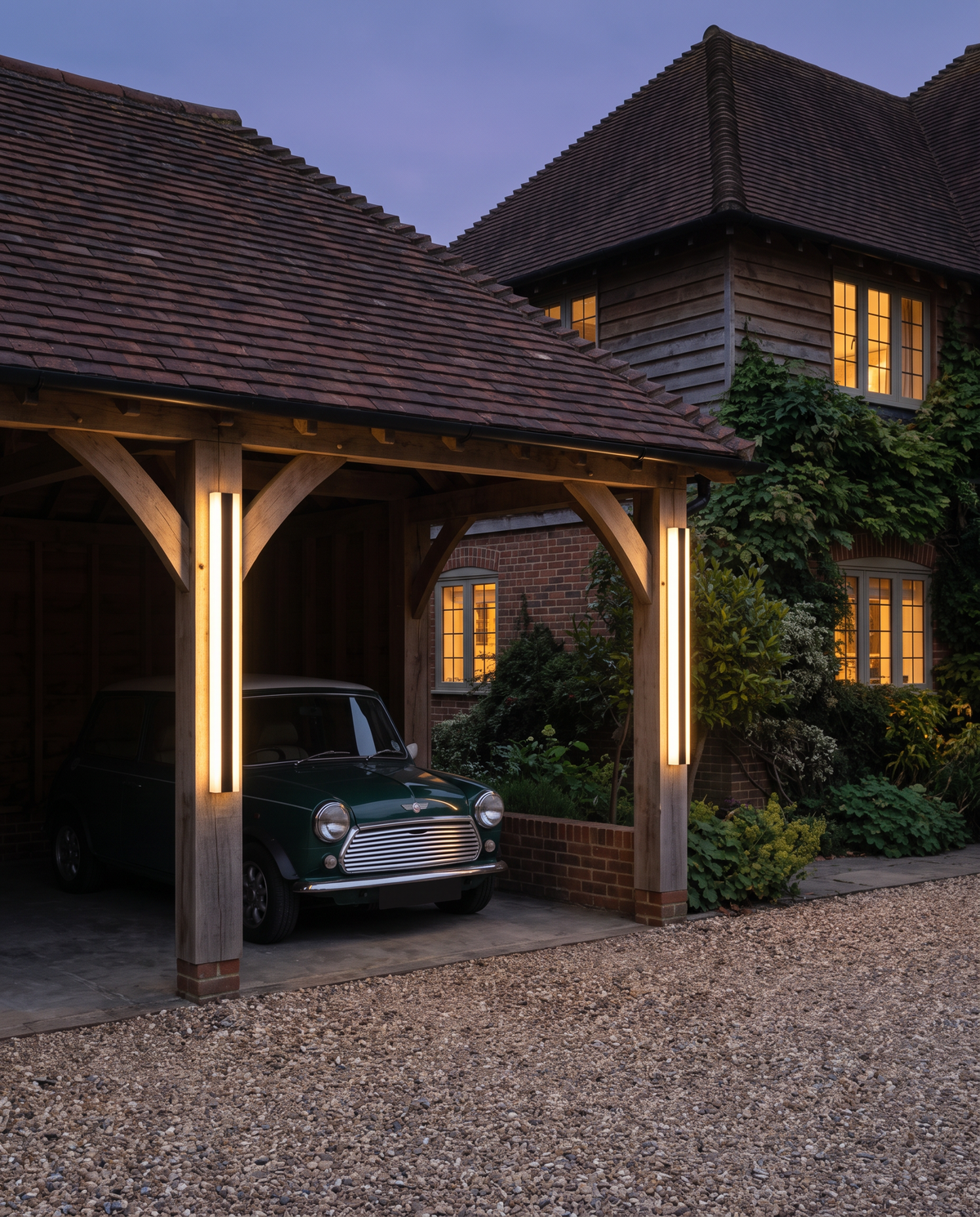 Sentry lights on the posts of an oak-framed carport