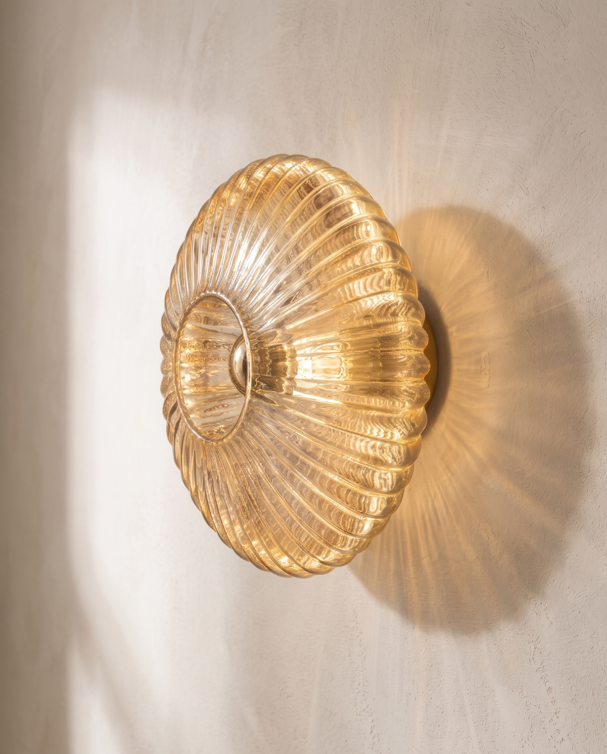 The Sunburst, side profile, amber ribbed glass — Selden Home product photography