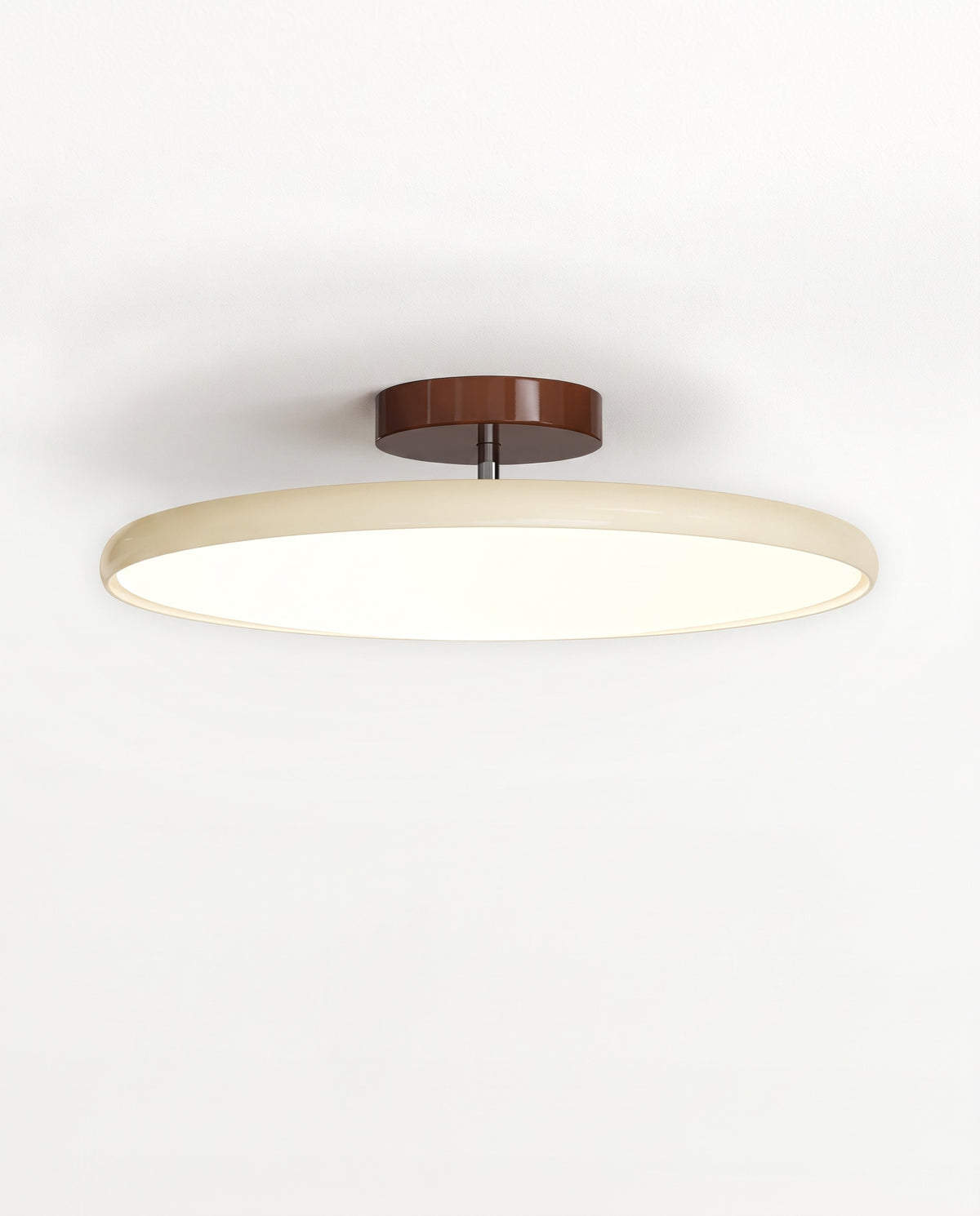 The Tilt Ceiling Light in Oatmeal, a thin LED disc on a short stem under a walnut-brown canopy, lit