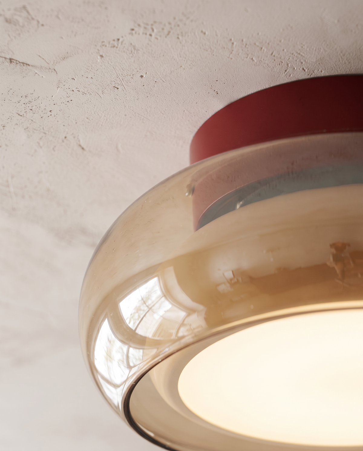 Close-up of the pillar-box red band and amber glass of The Toffee