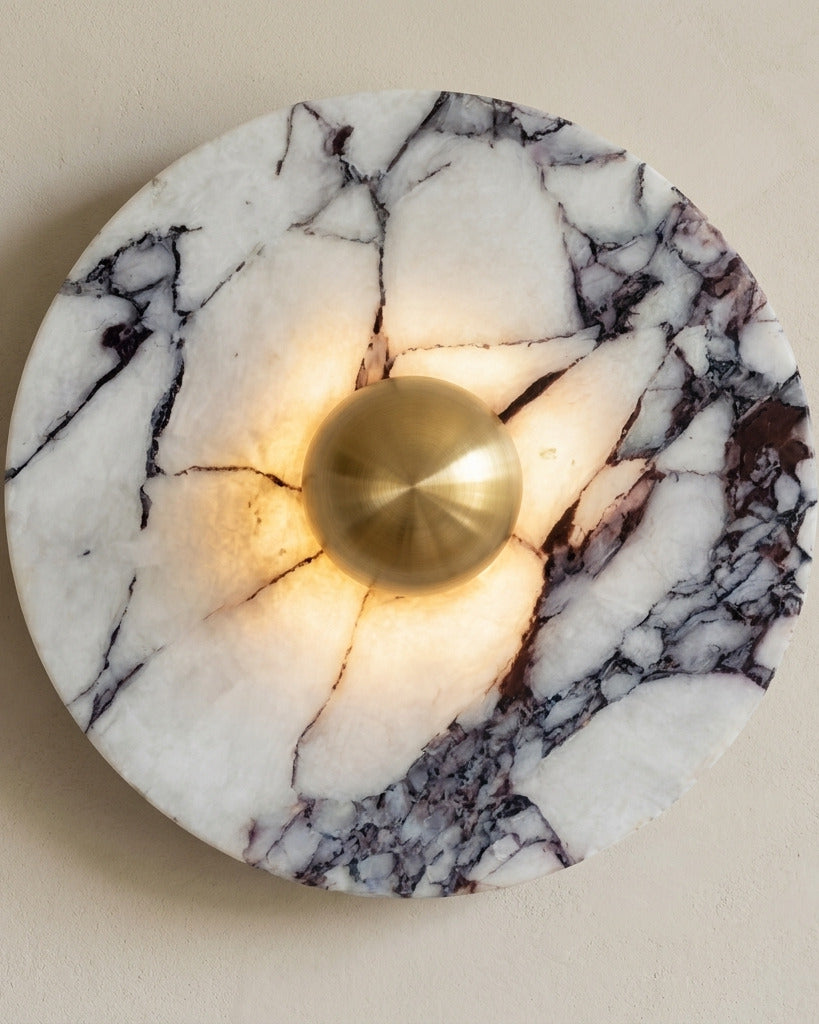 The Orb wall light in gold-tone marble finish, close-up marble texture and brass dome detail — Selden Home product photography