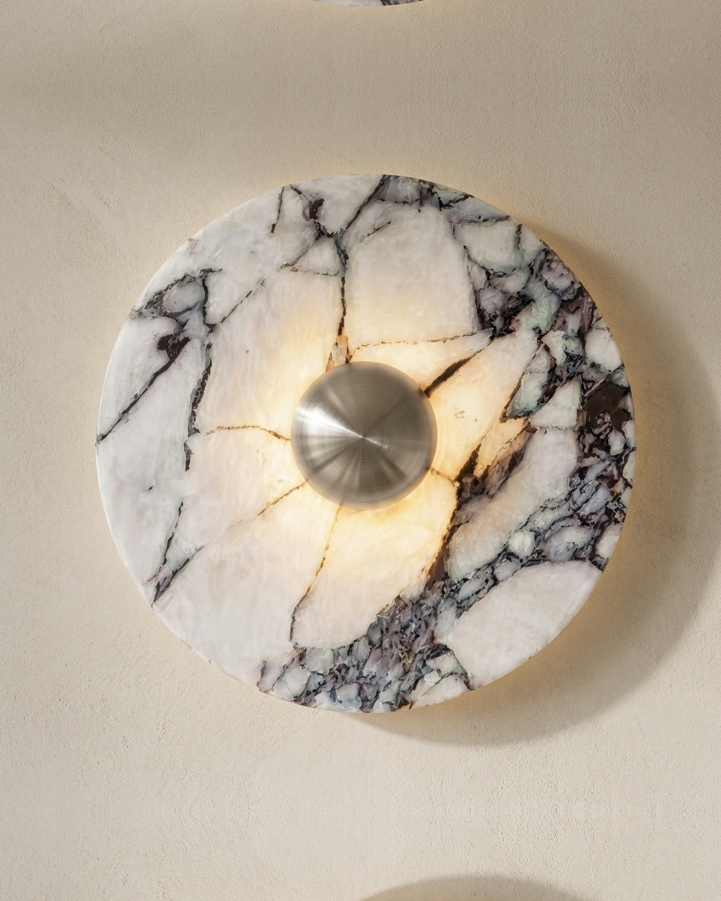 The Orb wall light in silver-tone marble finish, close-up marble texture and nickel dome detail — Selden Home product photography