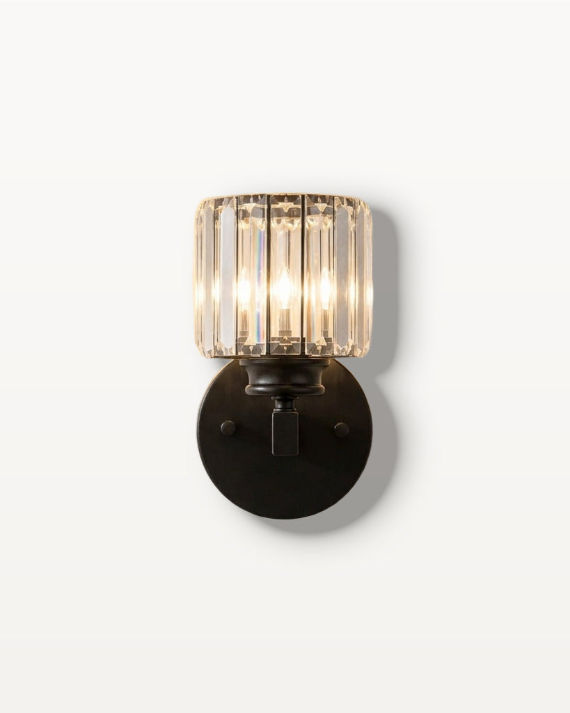 The Prism black art deco crystal wall sconce, lit, mounted on a lime-washed plaster wall — Selden Home product photography