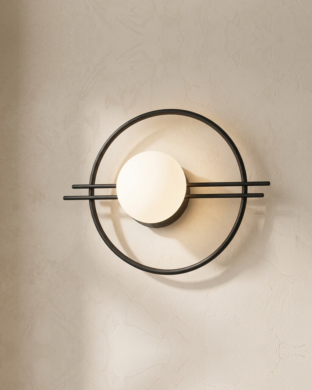 The Ring, close-up of black iron ring frame and frosted opal glass globe texture — Selden Home product photography